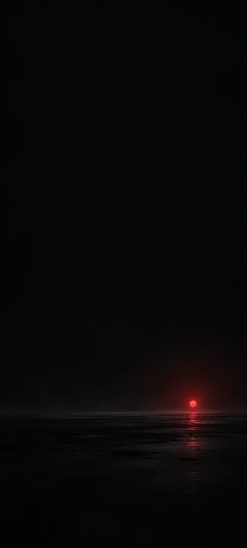 Small red glowing point and faint reflection above a low black plane.