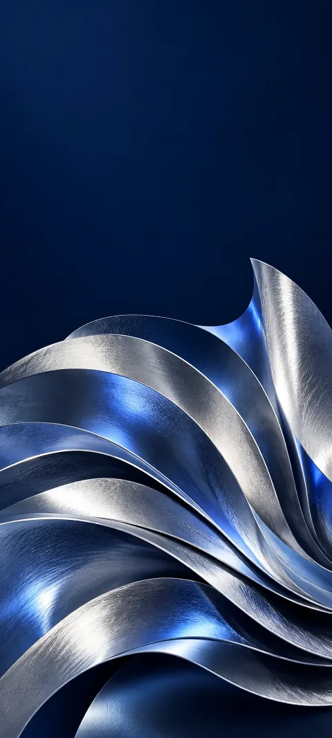Layered silver foil curves with blue reflections against deep navy.