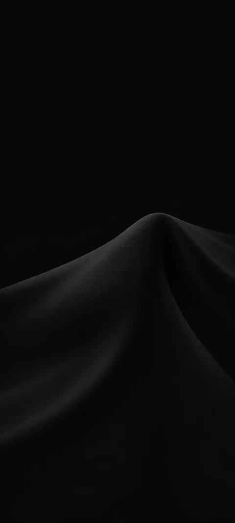 A soft charcoal fold rises from a black background.