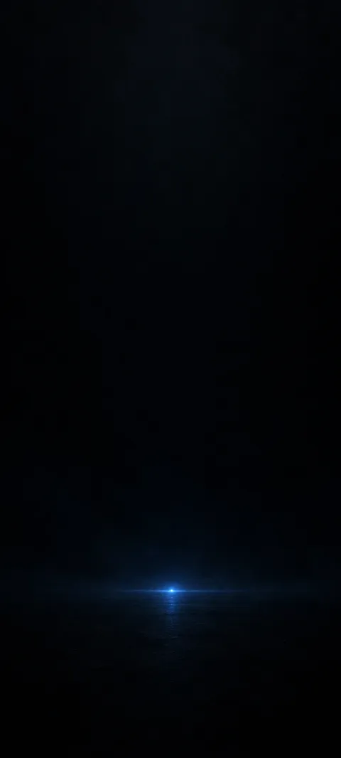 A tiny blue point glows in a broad black field.