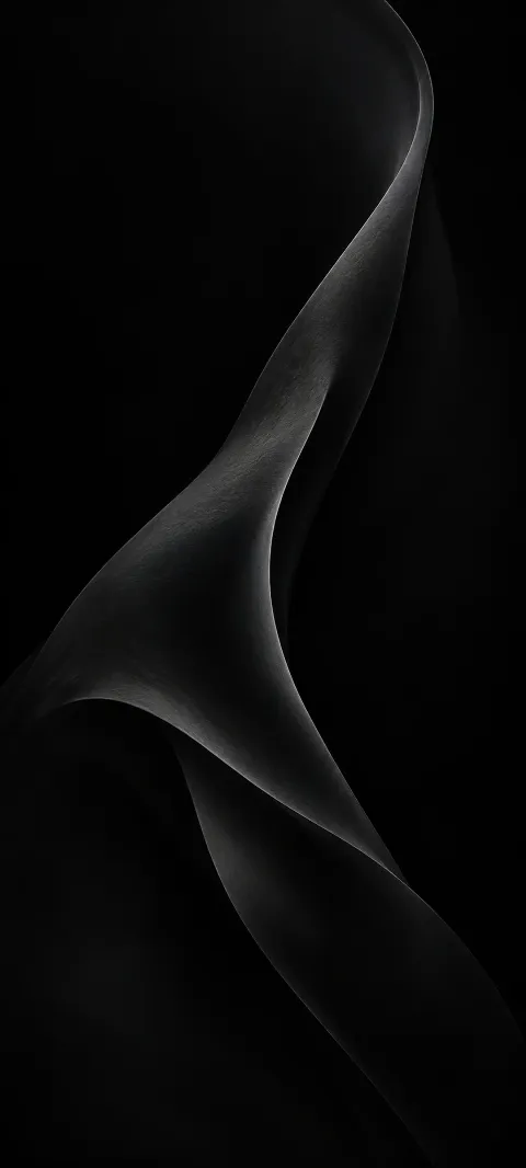 A soft charcoal fold rises from a black background.