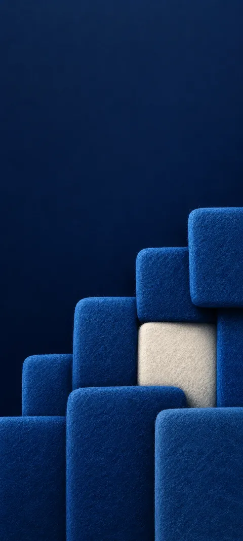 Overlapping blue felt squares around a recessed ivory square.
