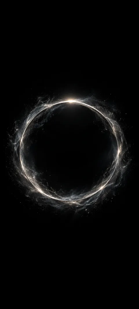 A dim silver halo floats in a black field.