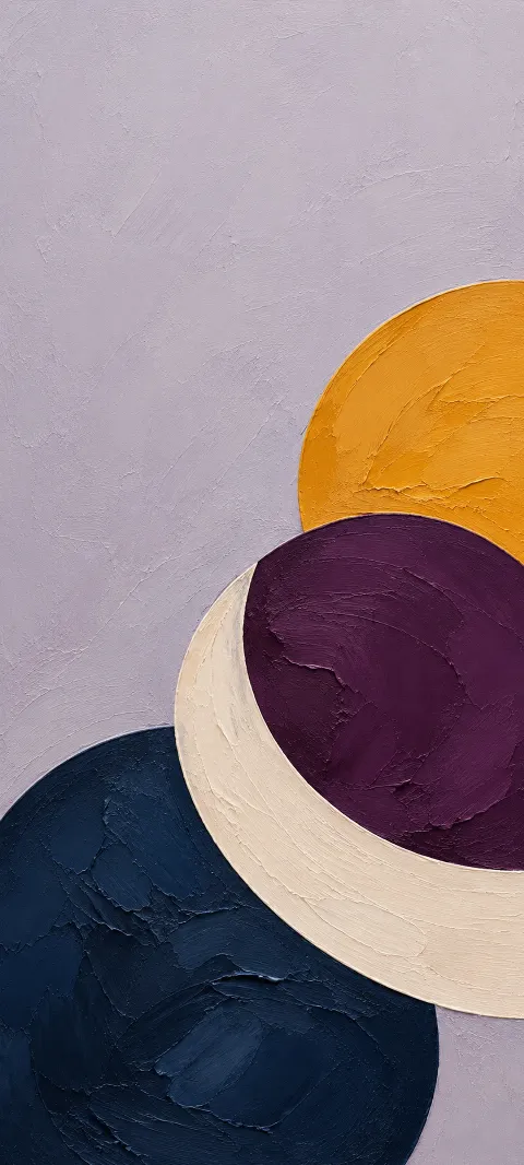 Saffron, plum and navy painted circles crossed by a cream crescent.