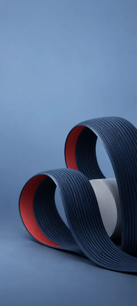 Ribbed navy oval arches with red interiors and a pale gray cylinder.