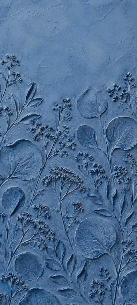 Blue clay impressions repeat like hand-pressed botanical marks.