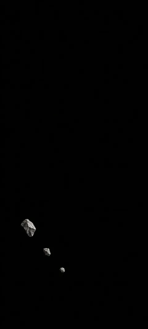 Three silver-gray fragments descending diagonally through a matte black field.