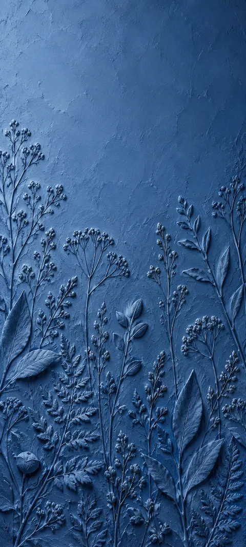 Blue clay impressions repeat like hand-pressed botanical marks.