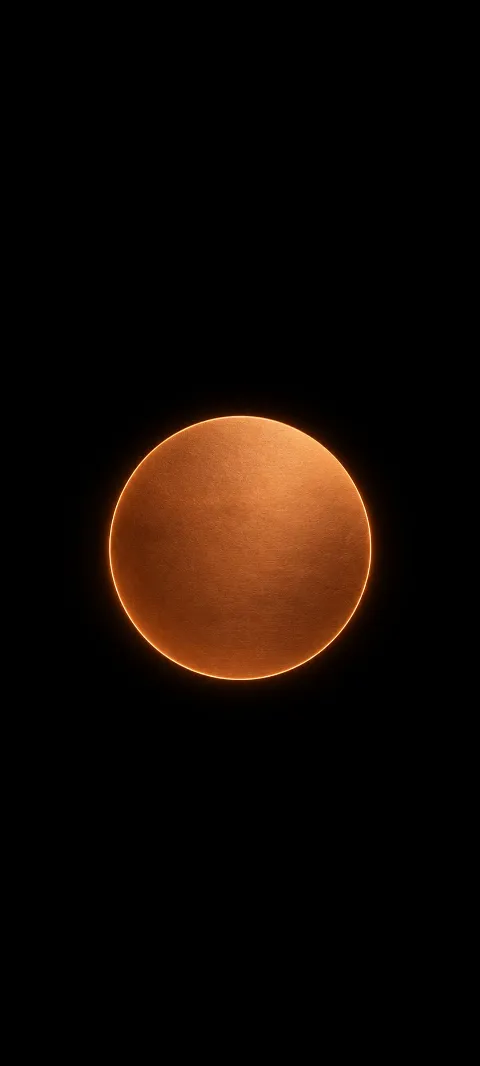 A flat copper disc sits below center on matte black.