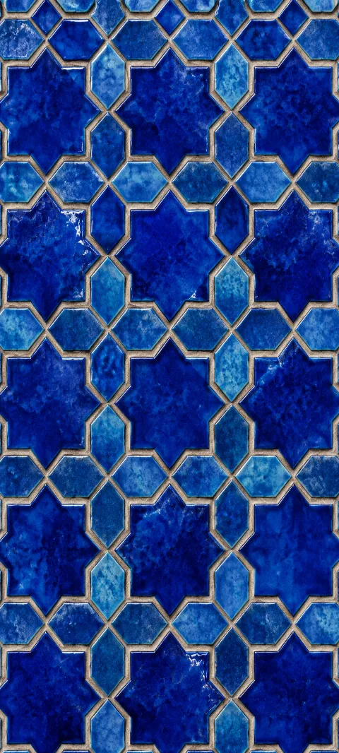 Cobalt star shapes repeat across warm terracotta ceramic.