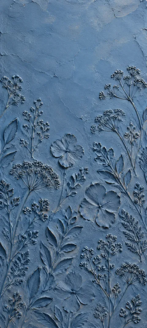 Blue clay impressions repeat like hand-pressed botanical marks.