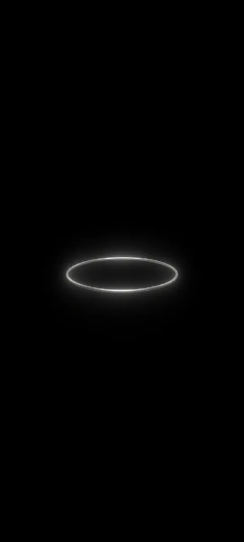 A dim silver halo floats in a black field.