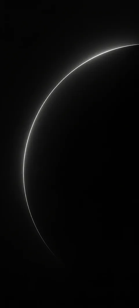 A restrained white arc emerges from graphite darkness.