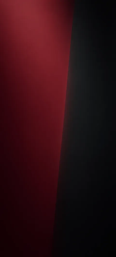 A muted burgundy plane meets charcoal darkness.
