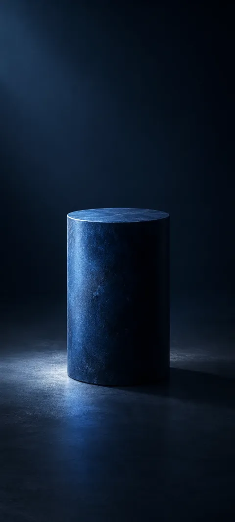 A dark blue cylinder stands in soft shadow.