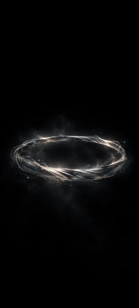 A dim silver halo floats in a black field.