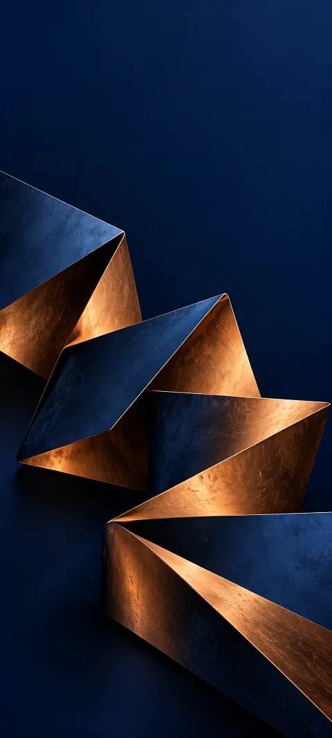Zigzag folded copper and indigo planes against a navy background.