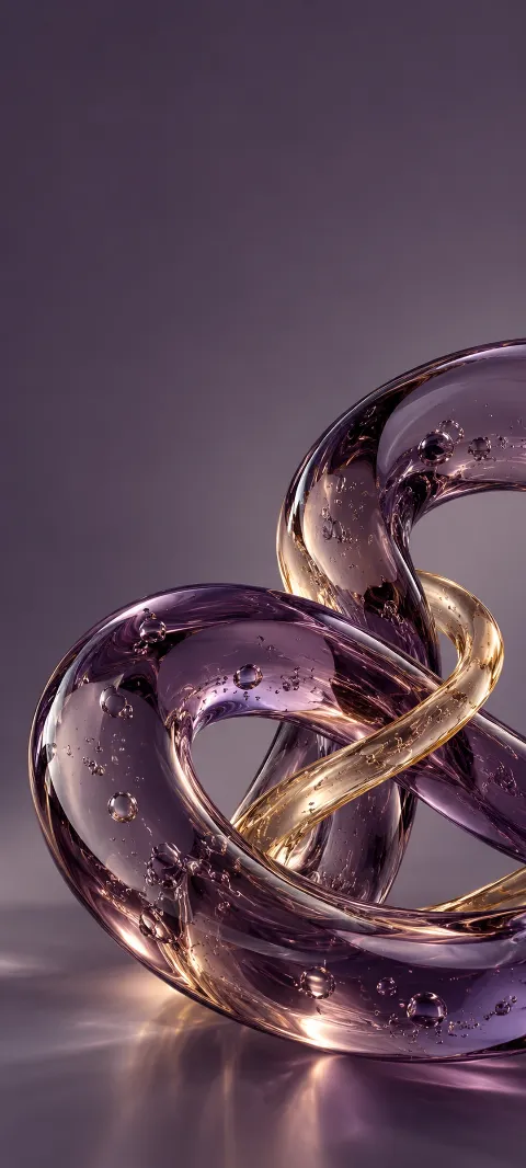 Violet glass loops crossed by a slender gold tube, with bubbles inside.
