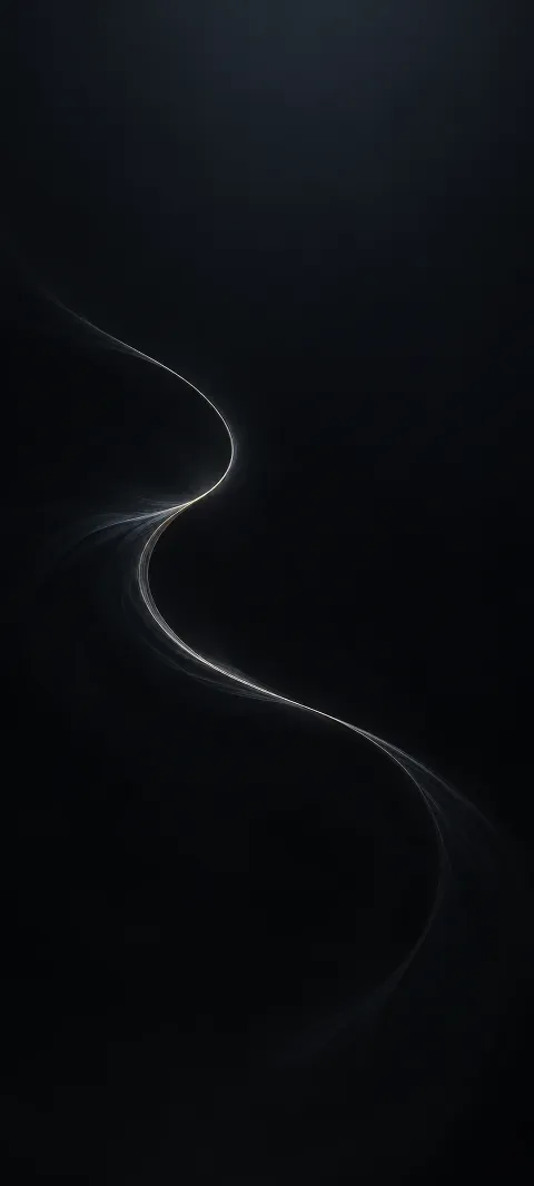 A pale thread curves across a black surface.