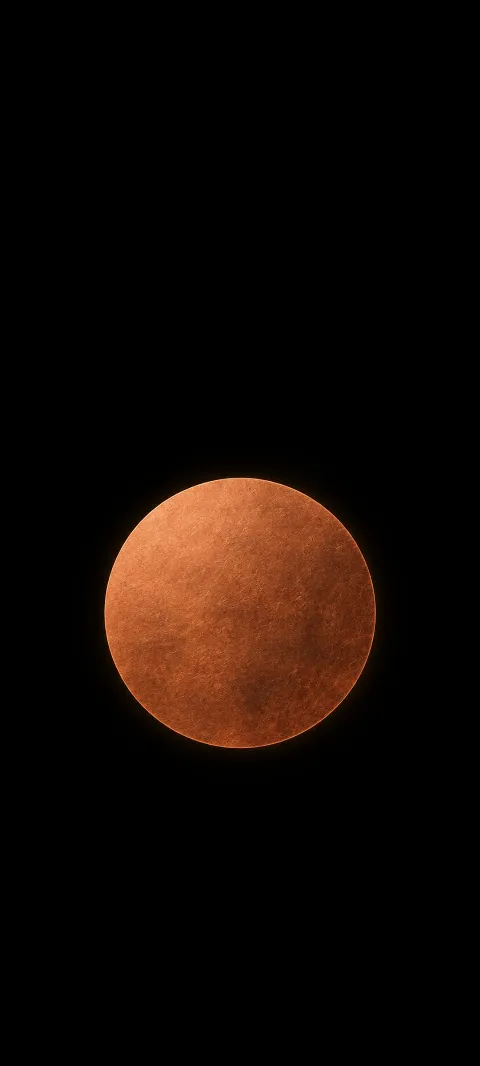 A textured copper disc with a faint edge glow against matte black.