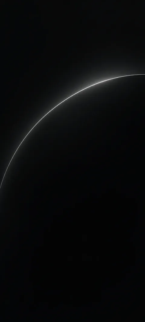 A thin softly glowing silver arc on a deep black field.