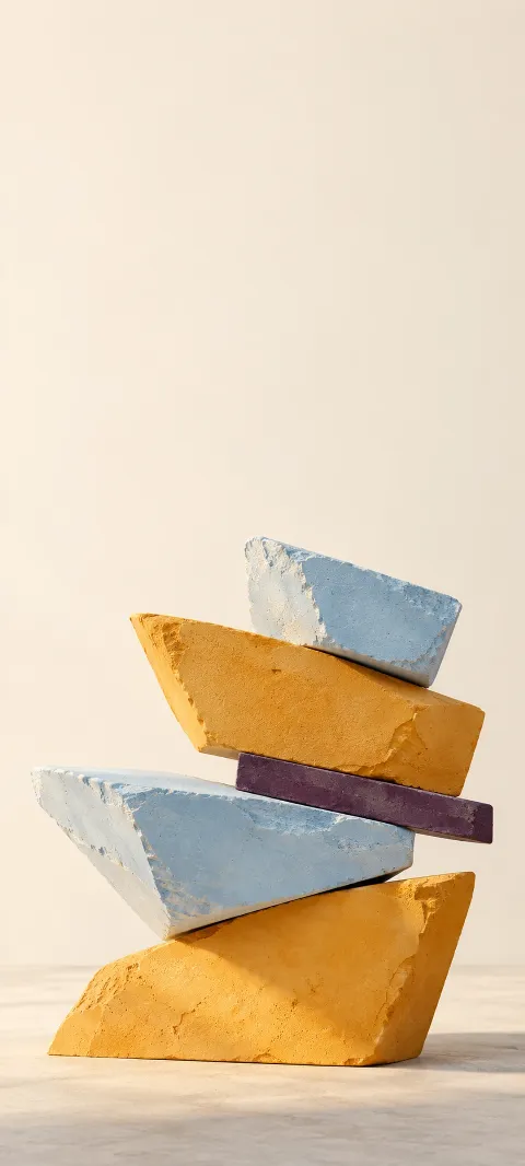 Stacked saffron and pale blue plaster wedges around a plum strip.