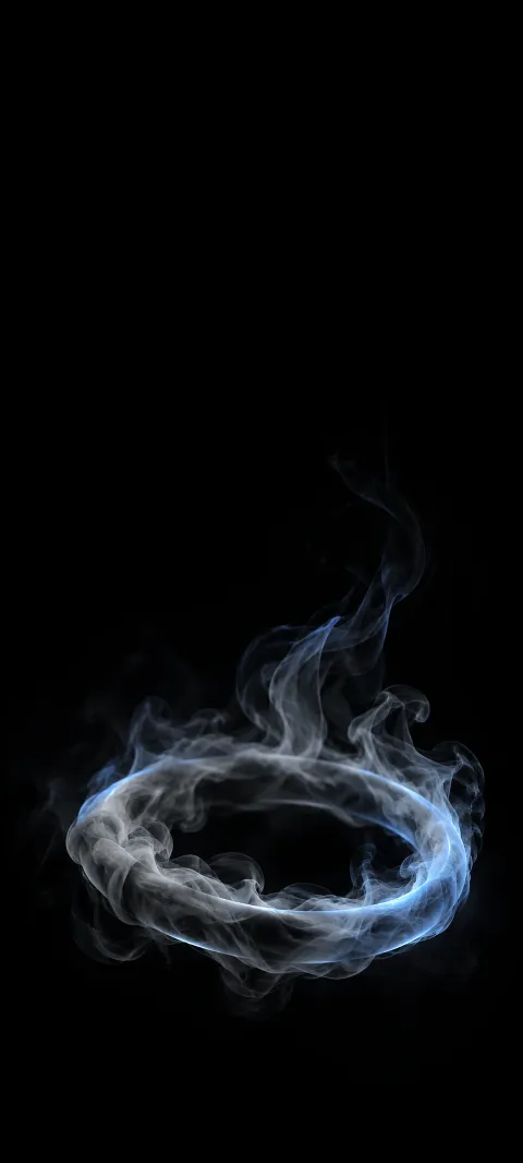 Gray smoke ring with pale blue edge light and wisps rising against black.