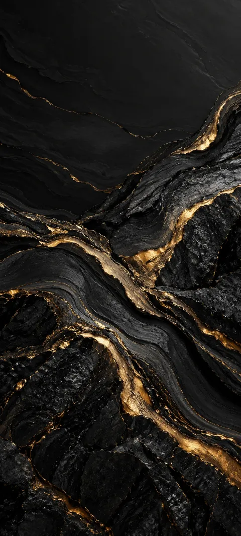 Black mineral grain carries narrow gold seams.