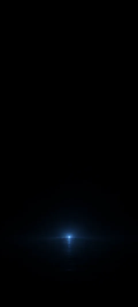 A tiny blue point glows in a broad black field.