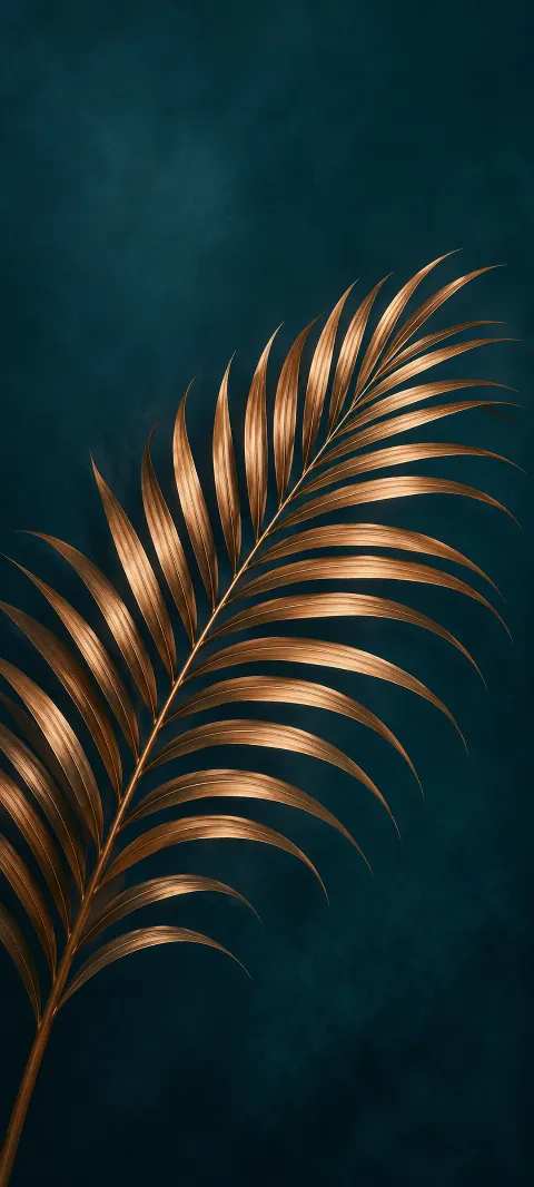 Copper colored palm frond with slender leaflets on a midnight teal background.