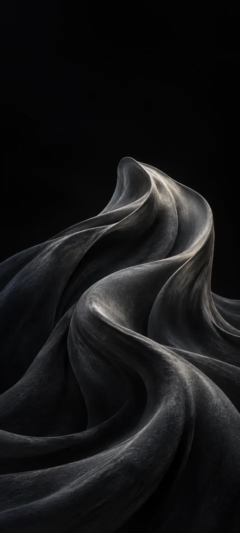A soft charcoal fold rises from a black background.
