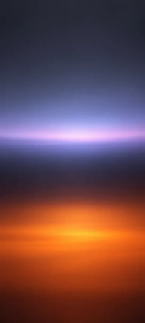 A narrow lavender band above a broad copper glow on charcoal.