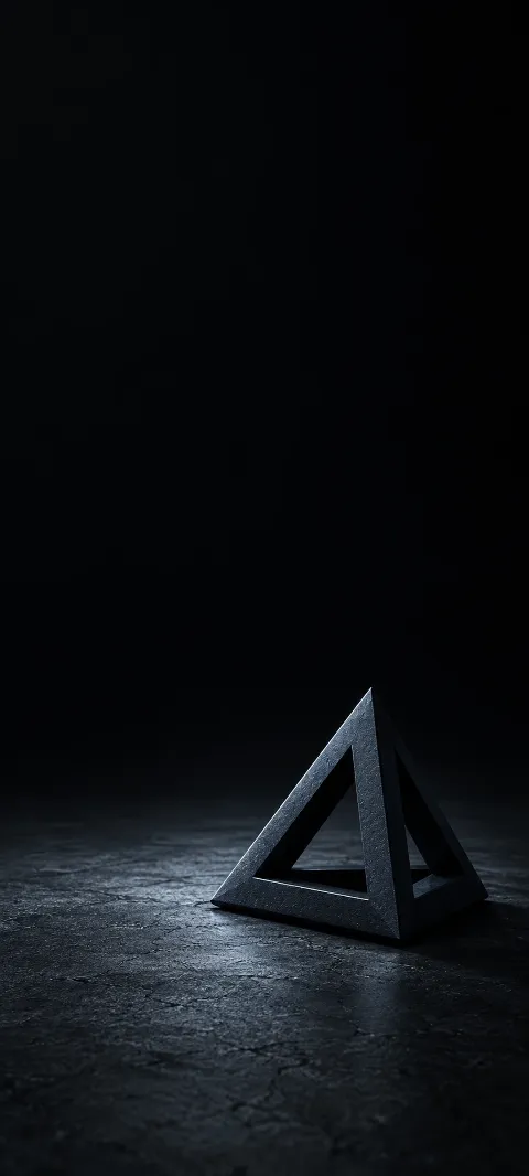 Small dark pyramid frame with open triangular faces on a black floor.