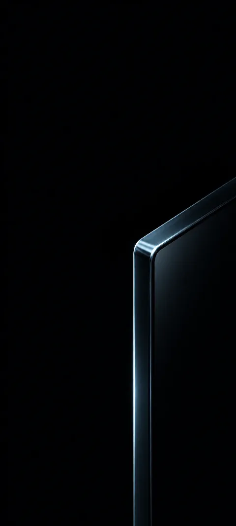 Silver-blue highlight outlining the beveled corner of a black glass slab.