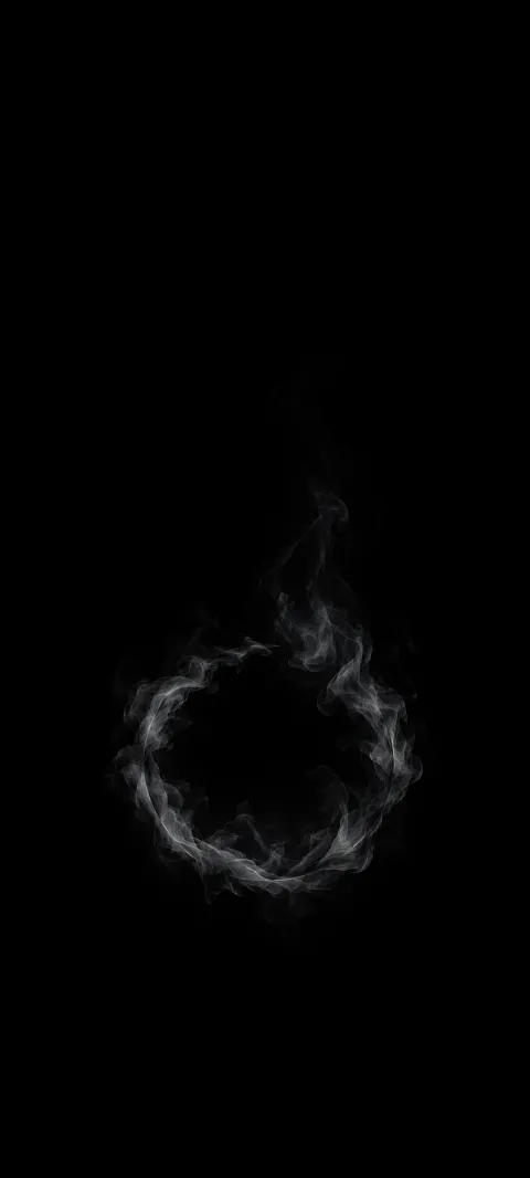 A faint gray smoke ring dissolving upward against black.