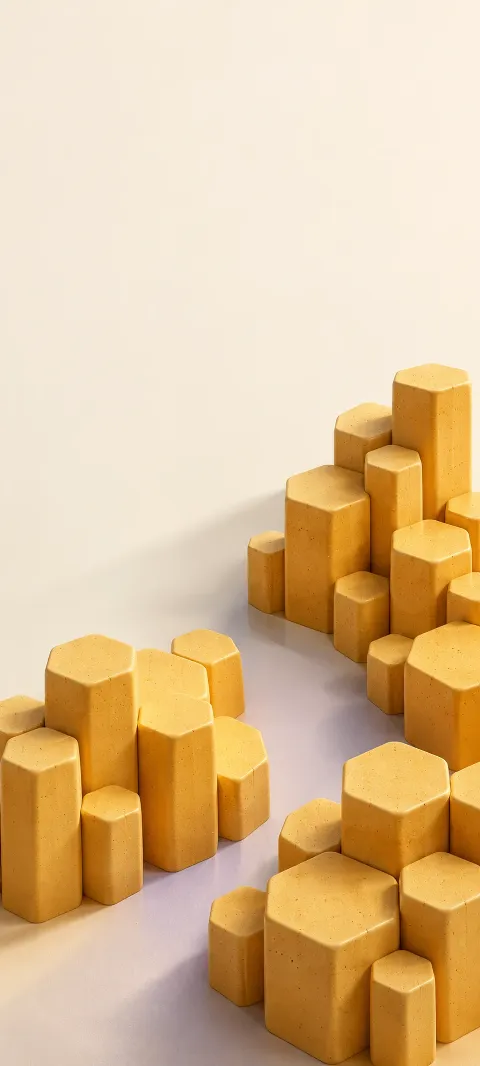 Honey-yellow hexagonal ceramic columns clustered across a pale lavender floor.