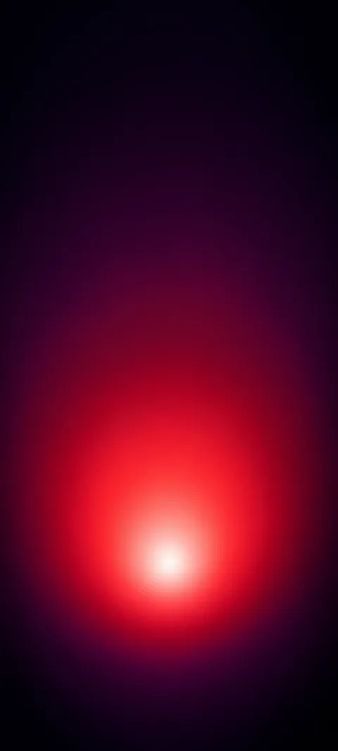 A low white glow inside a crimson halo fading to dark aubergine.