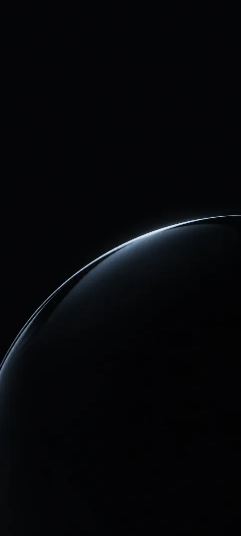A cool highlight traces the edge of black glass.